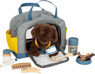 Perro con bolsa de transporte y set de cuidados