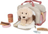 Dog with a pink bag and care set