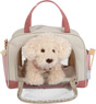 Dog with a pink bag and care set