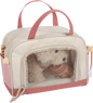 Dog with a pink bag and care set