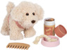 Dog with a pink bag and care set