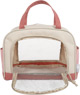 Dog with a pink bag and care set