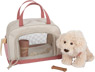 Dog with a pink bag and care set